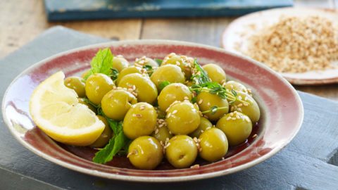 Spanish green olives marinated with sesame seeds